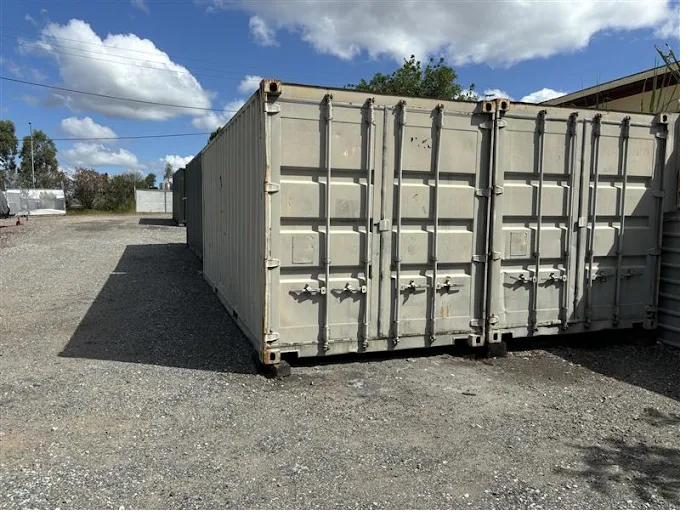 Rows of ground-level 20ft container storage units on flood-free hardstand in Oxley, Brisbane